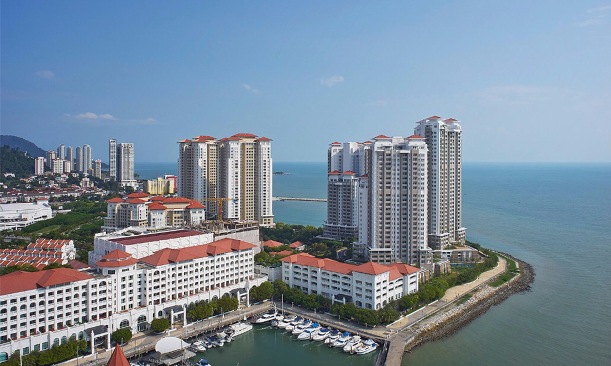 Luxury waterfront condominium buildings on Andaman Island Penang representing premium property pricing 2026