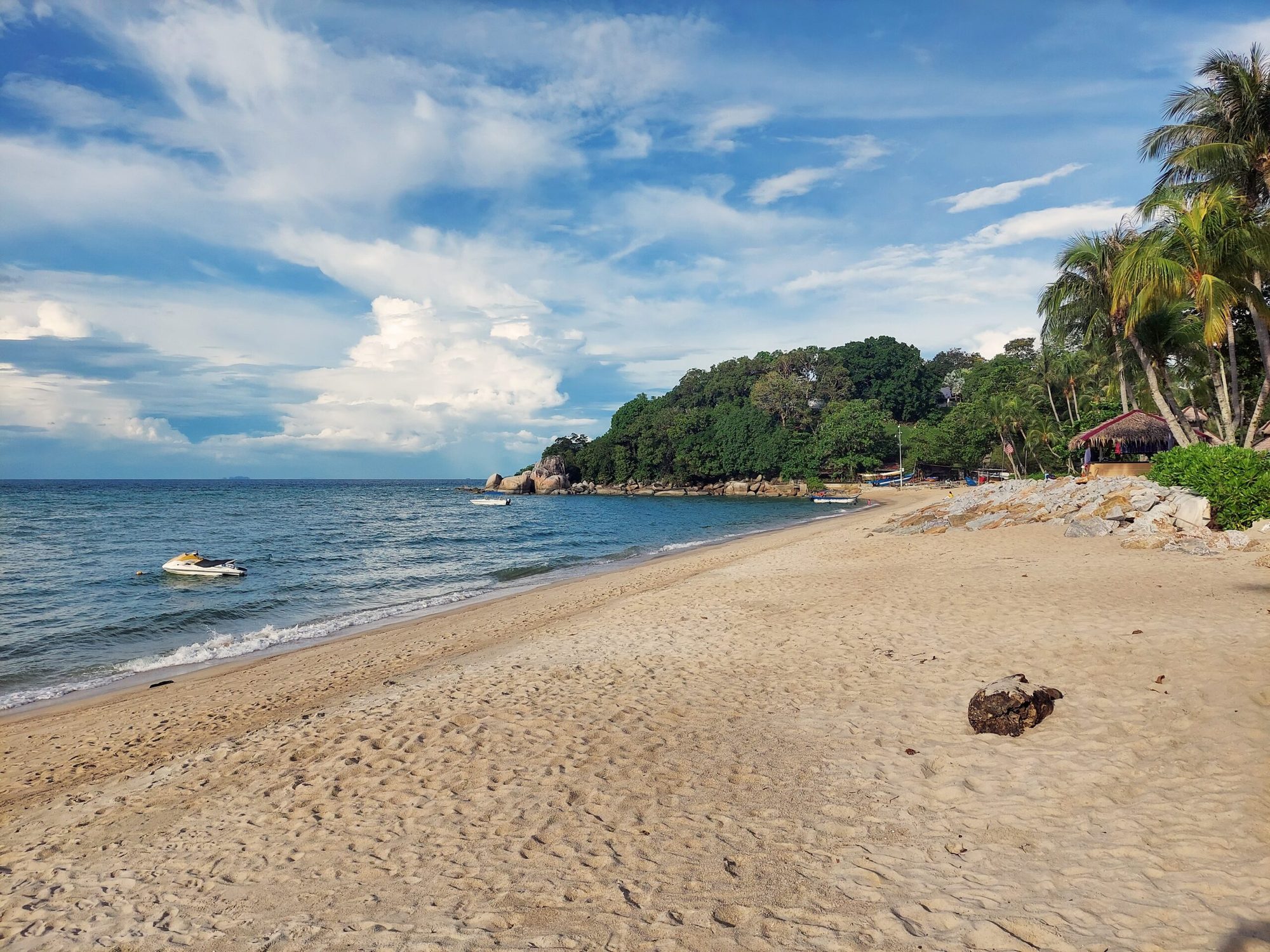 Batu Ferringhi beach with resort hotels and golden sand along Penang northern coastline